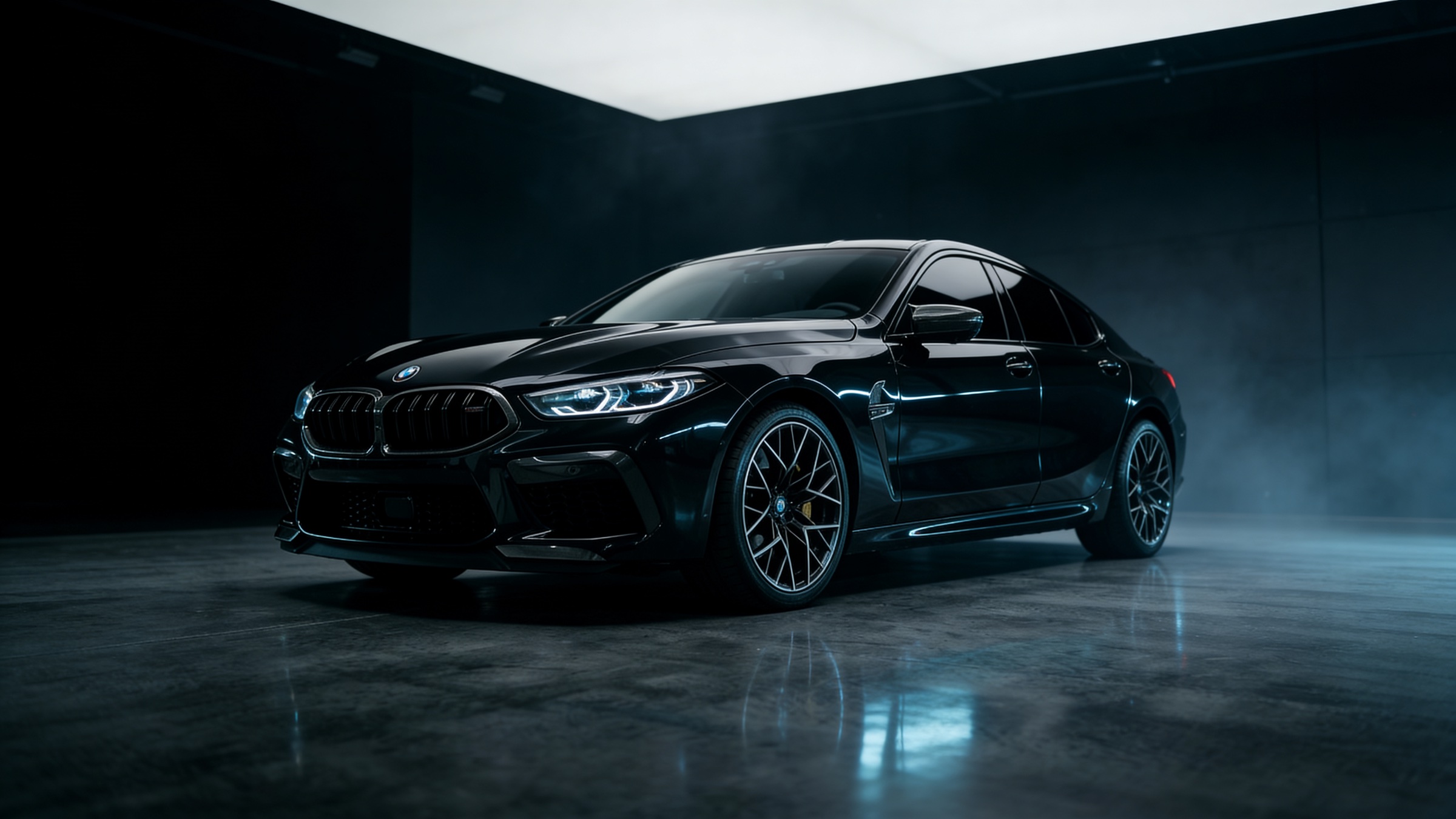 Blacked-out luxury car with fresh ceramic window tint in a professional detailing studio
